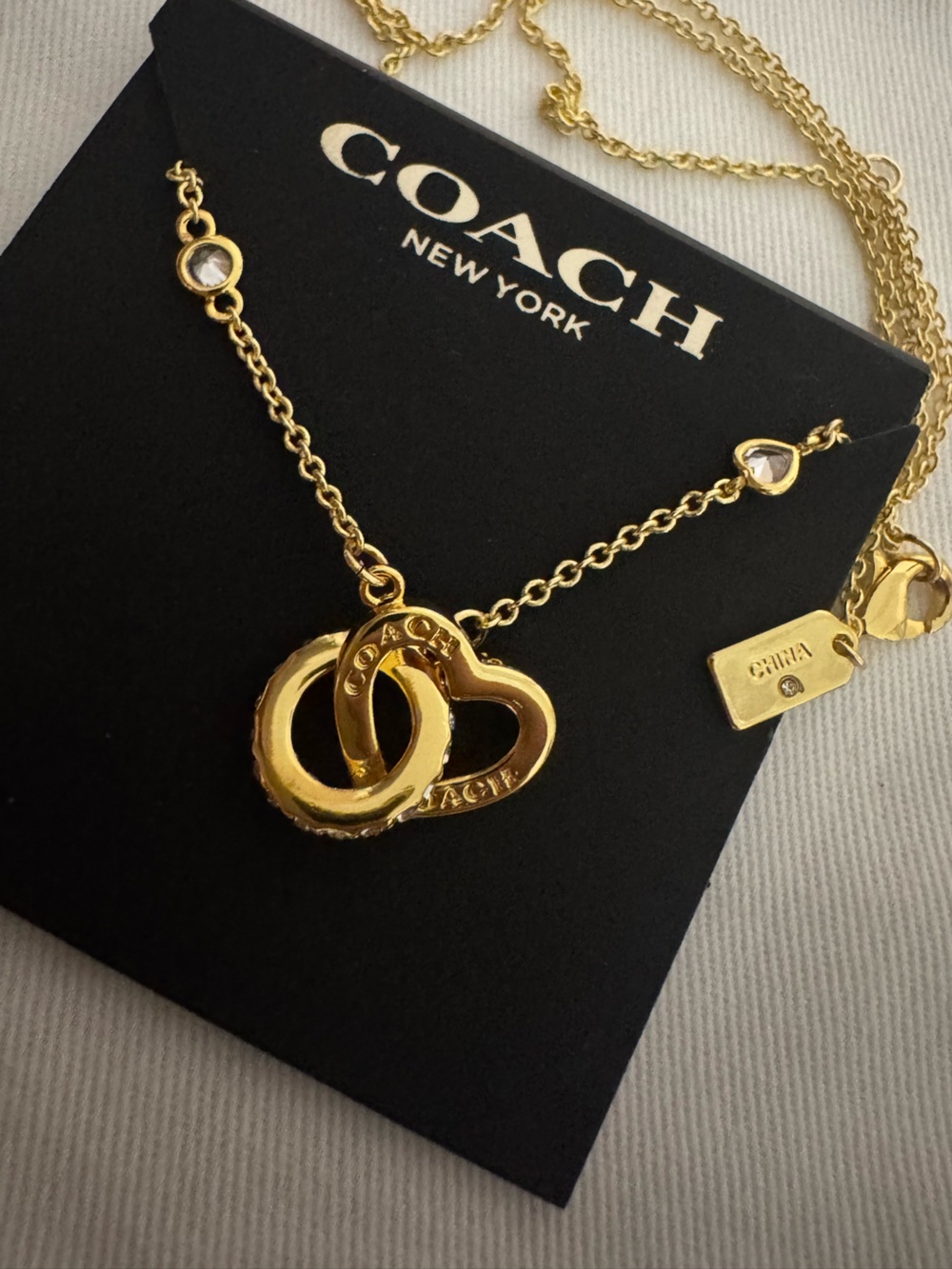 Coach Gold Interlocking Heart Necklace with Crystal Accents